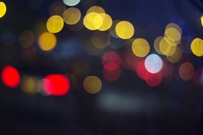 Defocused image of illuminated lights at night