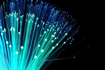 Close-up of fiber optic against black background