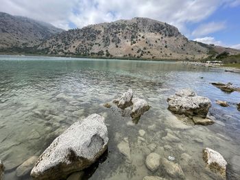 Scenic view of rocks in mountains against sky