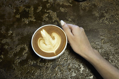 Midsection of coffee cup