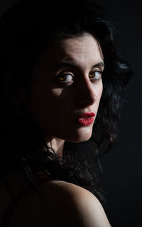 High contrast portrait of female model with light from the right side