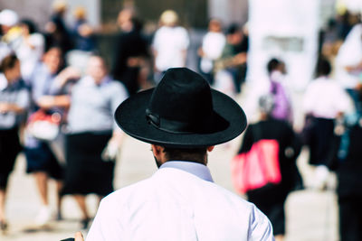 Rear view of man wearing hat