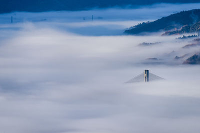 Crane against sky during foggy weather