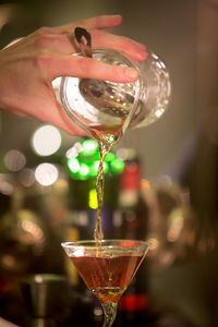 Close-up of hand holding glass of wine