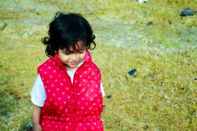 Close-up of smiling girl in grass