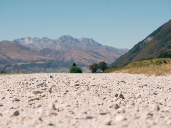 Surface level of field against mountains