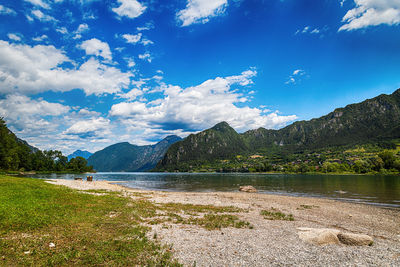 Scenic view of lake and mountains against sky