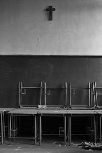 Empty chairs and tables in building