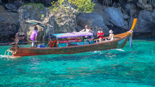 People in boat at sea