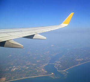 Aerial view of airplane flying in sky