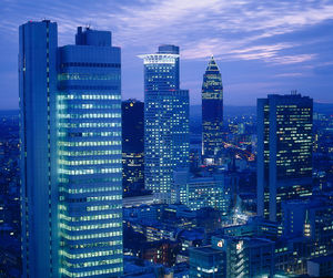 View of skyscrapers lit up at night