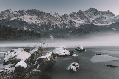 Scenic view of frozen lake against mountain