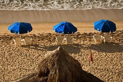 Deck chairs on sand