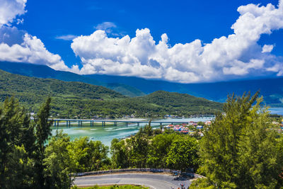 Scenic view of lake by trees against sky