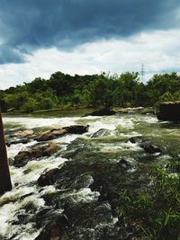 Scenic view of river against sky