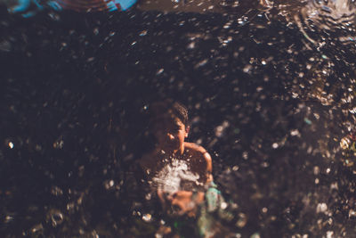 Water hose fun, spraying at a window