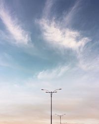 Low angle view of street light against sky