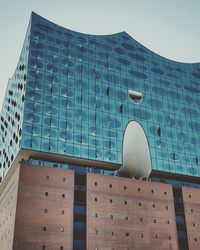 Low angle view of modern building against clear sky