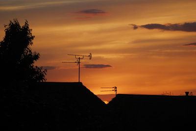 Silhouette trees against sky during sunset