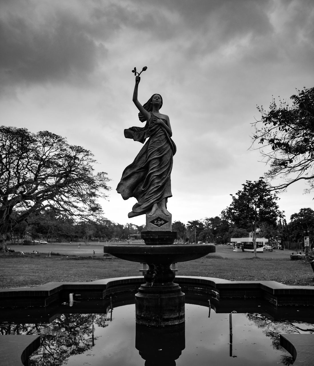 sky, statue, reflection, human representation, cloud - sky, travel destinations, sculpture, tree, water, outdoors, no people, day, architecture