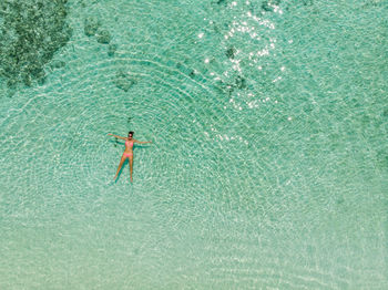 High angle view of man swimming in pool