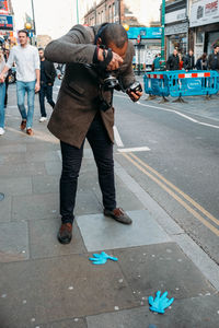 People standing on street in city