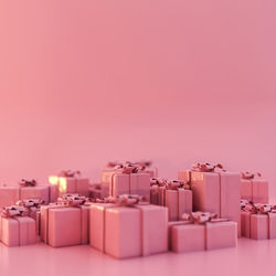 Christmas gifts isolated on pink