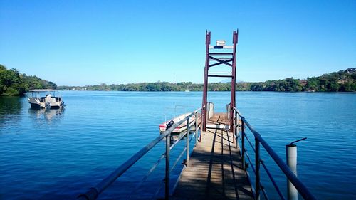 View of jetty in calm blue sea