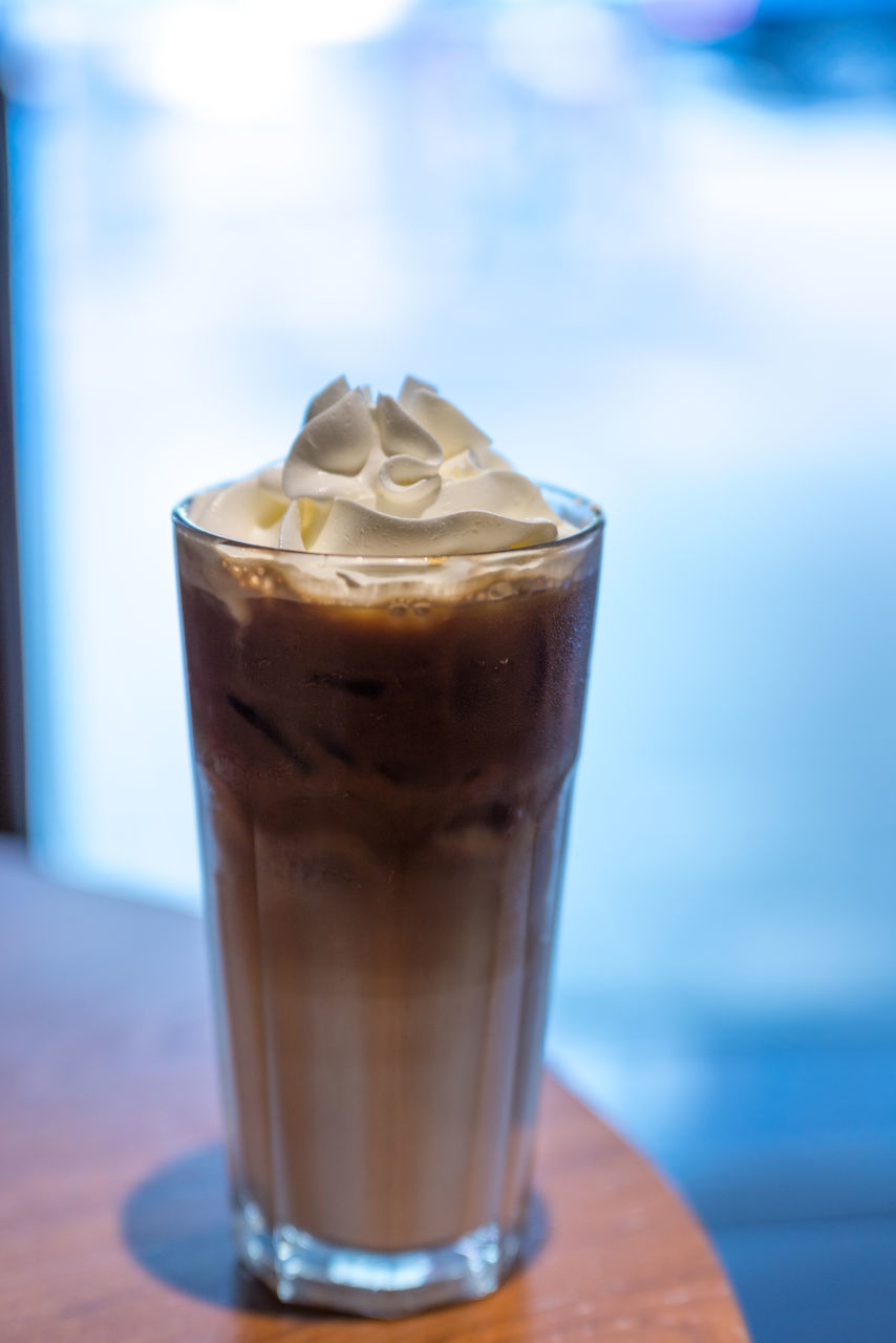 CLOSE-UP OF COFFEE CUP WITH ICE CREAM