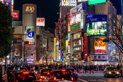 Illuminated city street at night