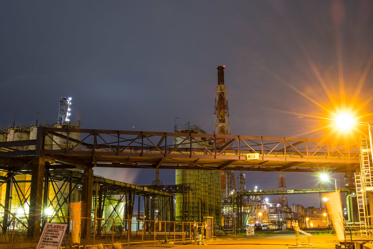 night, architecture, industry, built structure, sky, evening, illuminated, cityscape, nature, transportation, power generation, business, no people, business finance and industry, outdoors, oil industry, building exterior, factory, fossil fuel, dusk, water, lens flare, technology, petroleum, metal