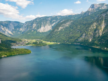 Scenic view of lake and mountains against sky