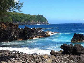 Scenic view of sea against clear blue sky