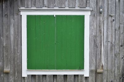 Close-up of closed window of old building