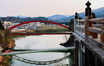 Bridge over mountains against sky