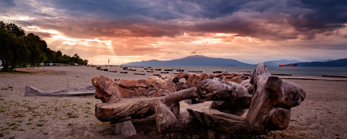 Panoramic view of beach against sky during sunset