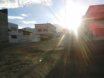 Sun shining through buildings