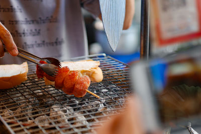 Midsection of person preparing food