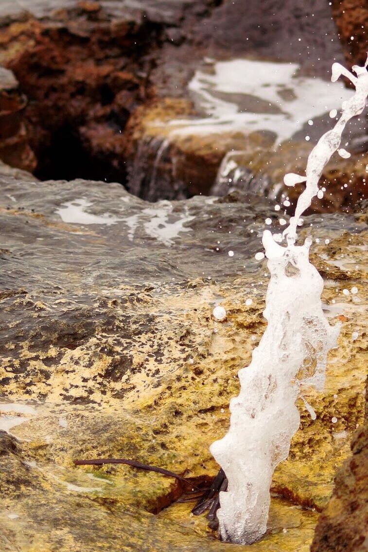 CLOSE-UP OF WATER SPLASHING IN SHALLOW