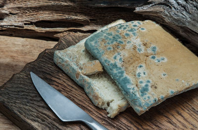 High angle view of bread on cutting board