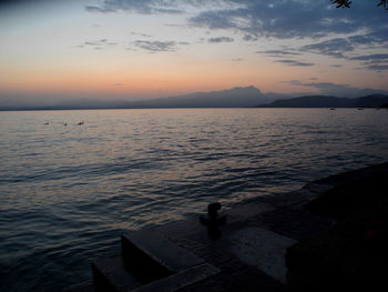 Scenic view of sea against sky at sunset