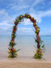 Decorated arch shaped flowers at beach