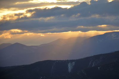 Scenic view of mountains against sky during sunset