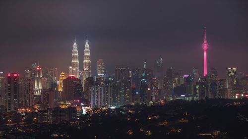 View of skyscrapers lit up at night