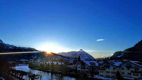 Scenic view of snowcapped mountains against sky during winter