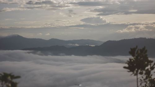 Scenic view of silhouette mountains against sky at sunset