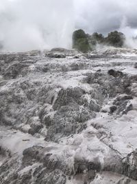 Scenic view of volcanic activity against sky