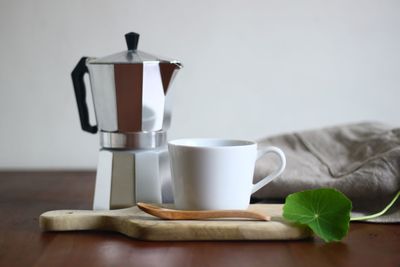 Close-up of coffee cup on table