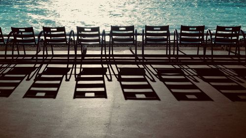 High angle view of chairs at beach