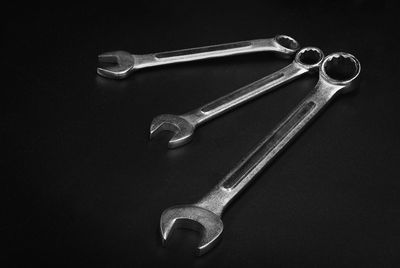 High angle view of chain on table against black background